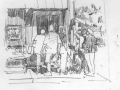 Men-hanging-around-shop-door