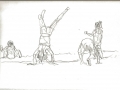 Children tumbling on beach